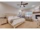 Spacious main bedroom with a fireplace, sitting area, and neutral decor at 2074 Sutton Way, Henderson, NV 89074