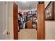 Walk-in closet with custom shelving and storage at 2074 Sutton Way, Henderson, NV 89074