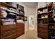 Walk-in closet with custom shelving and drawers at 2074 Sutton Way, Henderson, NV 89074