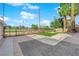 Charming backyard featuring grey brick pavers, decorative rock, and small manicured artificial grass at 2160 Pueblo Cir, Las Vegas, NV 89169