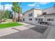 Backyard featuring manicured lawn, gravel and brick patio, and large dining table at 2160 Pueblo Cir, Las Vegas, NV 89169
