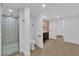 Bright bathroom with a glass-enclosed shower, modern fixtures, flamingo wallpaper, and clean white finishes for a fresh look at 2160 Pueblo Cir, Las Vegas, NV 89169