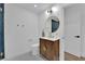 Chic bathroom featuring a modern vanity, decorative mirror, and stylish fixtures at 2160 Pueblo Cir, Las Vegas, NV 89169