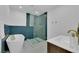 Luxurious bathroom featuring a soaking tub, glass-enclosed shower with stylish tile work, and modern fixtures at 2160 Pueblo Cir, Las Vegas, NV 89169
