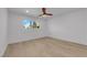 Bright bedroom features wood-look flooring, white walls, a ceiling fan and natural light from the window at 2160 Pueblo Cir, Las Vegas, NV 89169