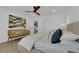 Bright bedroom featuring a comfortable bed, stylish decor and a view of the outdoors at 2160 Pueblo Cir, Las Vegas, NV 89169