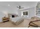 Serene bedroom with neutral tones, ceiling fan, a window seat and natural light at 2160 Pueblo Cir, Las Vegas, NV 89169