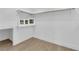 Walk-in closet featuring wood floors, bright light fixture, and shelving for storage at 2160 Pueblo Cir, Las Vegas, NV 89169