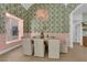 Dining room with vibrant wallpaper, stylish lighting, and seating for six at 2160 Pueblo Cir, Las Vegas, NV 89169