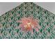 Close up of an ornate pink chandelier and whimsical wallpaper in the dining room at 2160 Pueblo Cir, Las Vegas, NV 89169