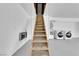Garage staircase to the second level with a utility box and laundry machines below at 2160 Pueblo Cir, Las Vegas, NV 89169