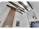 A modern great room design with exposed beams, a brick fireplace, and a mezzanine at 2160 Pueblo Cir, Las Vegas, NV 89169
