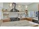 This contemporary kitchen features granite counters, stainless appliances and stylish open shelving at 2160 Pueblo Cir, Las Vegas, NV 89169