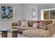 Stylish living room showcasing a plush sectional sofa with accent pillows, and abundant natural light at 2160 Pueblo Cir, Las Vegas, NV 89169