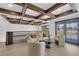 Second story living room includes a coffered ceiling and two sets of double doors out to the balcony at 2160 Pueblo Cir, Las Vegas, NV 89169