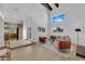 Open-concept living room connecting to the kitchen, featuring lots of natural light and comfortable seating at 2160 Pueblo Cir, Las Vegas, NV 89169