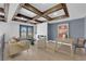 Living room with coffered ceiling, fireplace, and french door access to outdoor balcony at 2160 Pueblo Cir, Las Vegas, NV 89169