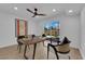 Well-lit home office with contemporary decor, natural light from the backyard, and cozy seating for a productive atmosphere at 2160 Pueblo Cir, Las Vegas, NV 89169