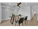 Modern office space with stylish decor, backyard view and a unique ceiling fan, ideal for a comfortable workspace at 2160 Pueblo Cir, Las Vegas, NV 89169