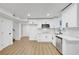 Bright kitchen with white cabinetry, stainless steel appliances, and modern backsplash, and laminate flooring at 2521 Richfield Blvd, Las Vegas, NV 89102