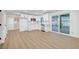Bright kitchen with white cabinetry and stainless steel appliances, with sliding door access to backyard at 2521 Richfield Blvd, Las Vegas, NV 89102