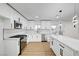Bright kitchen featuring sleek white cabinets, stainless steel appliances, and a stylish backsplash at 2521 Richfield Blvd, Las Vegas, NV 89102