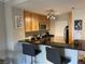 Charming kitchen with stainless steel appliances, wood cabinets, granite countertops, and breakfast bar at 260 E Flamingo Rd # 228, Las Vegas, NV 89169