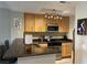 Well-lit kitchen featuring stainless steel appliances, wood cabinetry, and granite countertops at 260 E Flamingo Rd # 228, Las Vegas, NV 89169