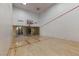 Bright and clean indoor racquetball court with hardwood floors and an open view of other interior rooms at 260 E Flamingo Rd # 228, Las Vegas, NV 89169