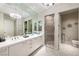 Bathroom featuring a dual sink vanity with modern fixtures and a glass enclosed shower at 2747 Paradise Rd # 206, Las Vegas, NV 89109
