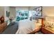 Comfortable bedroom with a large bed, neutral color palette, modern art and great natural light at 2747 Paradise Rd # 206, Las Vegas, NV 89109