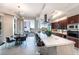 Modern kitchen with a large island, seating, stainless steel appliances, and views from the large windows at 2747 Paradise Rd # 206, Las Vegas, NV 89109