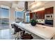 Bright, modern kitchen with stainless appliances, a large island, and a view of the city skyline at 2747 Paradise Rd # 206, Las Vegas, NV 89109