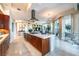 Modern kitchen with large island and stainless steel appliances, open to a stylish living area and bright, airy windows at 2747 Paradise Rd # 206, Las Vegas, NV 89109
