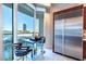 Cozy kitchen nook with stainless steel refrigerator and views of the city skyline at 2747 Paradise Rd # 206, Las Vegas, NV 89109