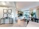Stylish living room featuring modern decor, built-in display shelving, and large windows for natural light at 2747 Paradise Rd # 206, Las Vegas, NV 89109