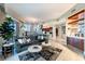 Open-concept living space with a large sofa, modern kitchen, dining area, and stylish decor, creating a comfortable atmosphere at 2747 Paradise Rd # 206, Las Vegas, NV 89109