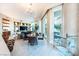 Open-concept living room with built-in shelving, dining area, floor to ceiling window, and modern furnishings at 2747 Paradise Rd # 206, Las Vegas, NV 89109