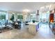 Open-concept living space with modern kitchen, dining area, and comfortable lounge, featuring large windows and sleek finishes at 2747 Paradise Rd # 206, Las Vegas, NV 89109