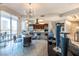 Open floor plan showcases the kitchen, dining, and living spaces with modern decor and ample natural light at 2747 Paradise Rd # 206, Las Vegas, NV 89109