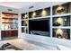 Living area with custom built-in shelving and cabinets, providing ample storage and display space at 2747 Paradise Rd # 206, Las Vegas, NV 89109