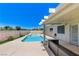 Beautiful backyard oasis with a sparkling pool, spa, and outdoor seating area at 2848 Skowhegan Dr, Henderson, NV 89074