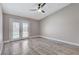 Bright bedroom featuring wood-look floors and direct access to the outdoor pool at 2848 Skowhegan Dr, Henderson, NV 89074