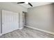 Neutral bedroom with wood floors, closet and doorway view to hallway at 2848 Skowhegan Dr, Henderson, NV 89074