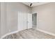 Bedroom with wood-look floors, white baseboards, and a closet with folding doors at 2848 Skowhegan Dr, Henderson, NV 89074