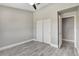 Bedroom featuring closet, wood-look floors and doorway to the bathroom at 2848 Skowhegan Dr, Henderson, NV 89074