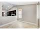 Bright dining area featuring tile floors, modern light fixture and adjacent kitchen view at 2848 Skowhegan Dr, Henderson, NV 89074
