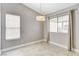 Well-lit dining area showcasing neutral walls, window with blinds and tile flooring at 2848 Skowhegan Dr, Henderson, NV 89074