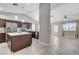 Modern kitchen with dark wood cabinetry, stainless steel appliances, and a center island at 2848 Skowhegan Dr, Henderson, NV 89074