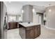 Inviting kitchen showcasing a center island with cabinet space, and modern lighting at 2848 Skowhegan Dr, Henderson, NV 89074